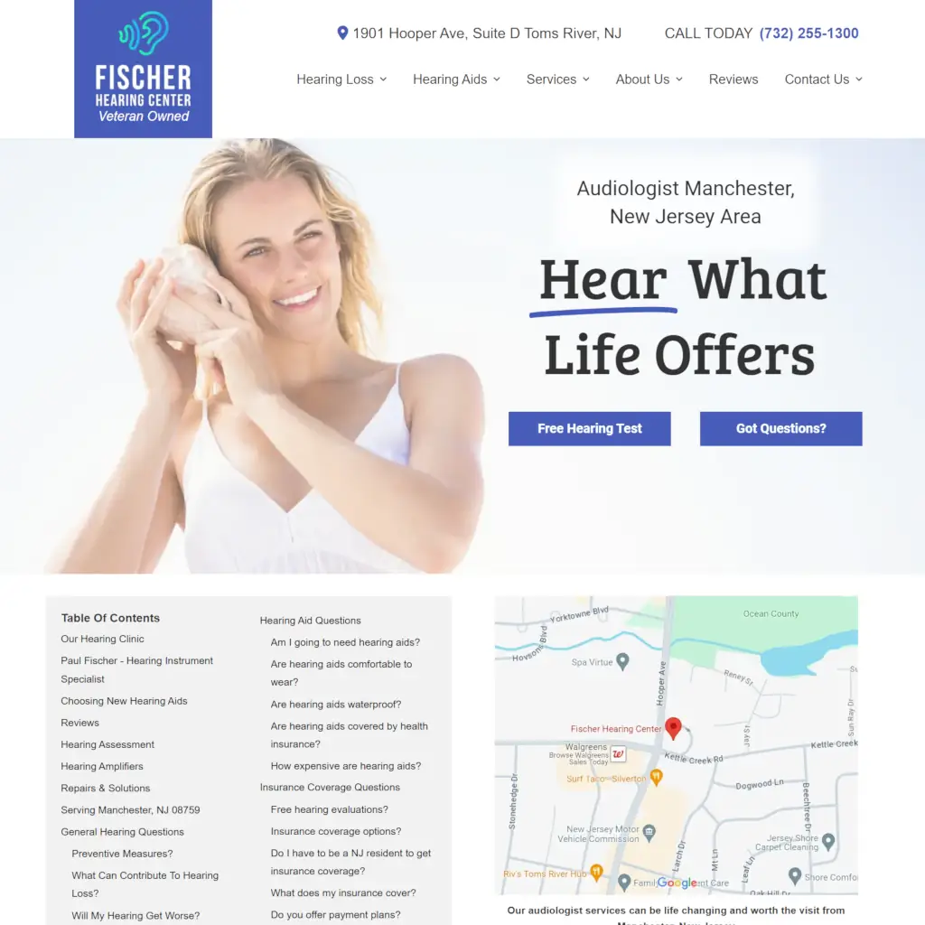 Fischer Hearing Center Manchester NJ landing page with navigation menu, hero section featuring woman with hearing aid, and call-to-action buttons.