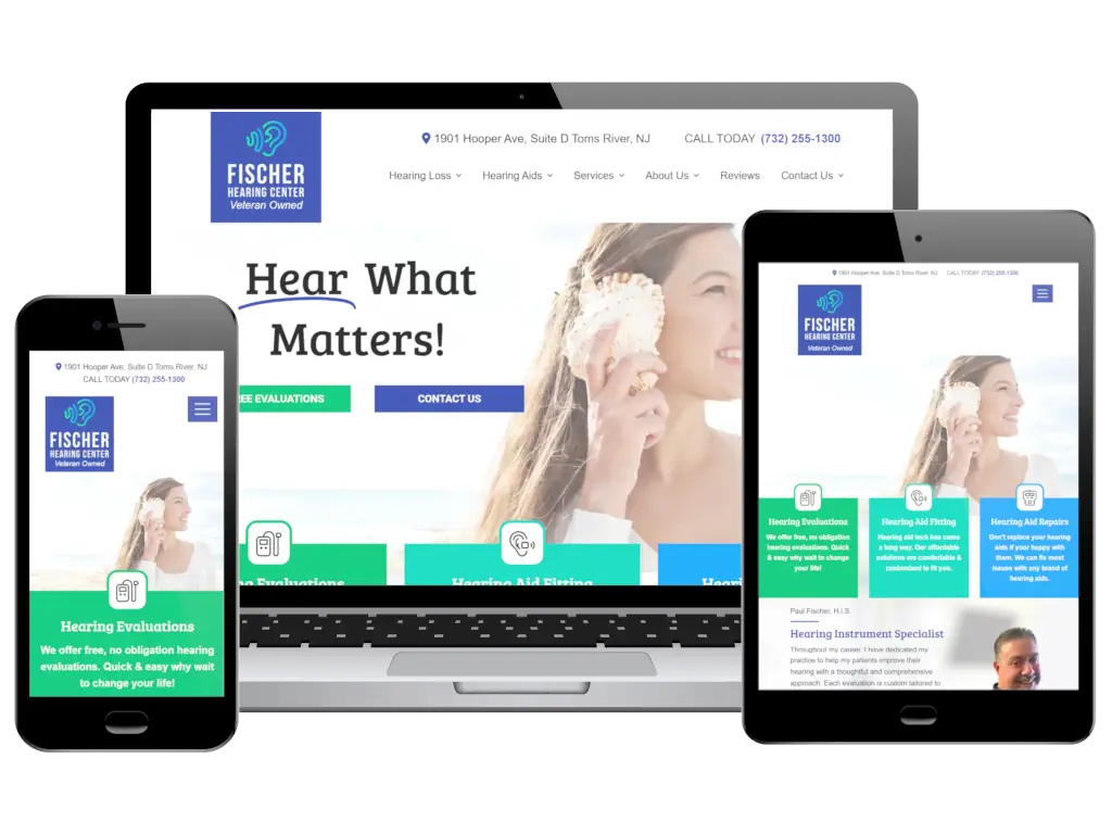 Fischer Hearing Center responsive web design showing mobile, tablet, and desktop layouts with hearing evaluation services and contact information.